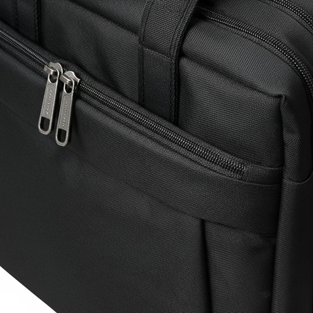 Close-up of MaxPro Laptop Bag with zippers and a brand logo.